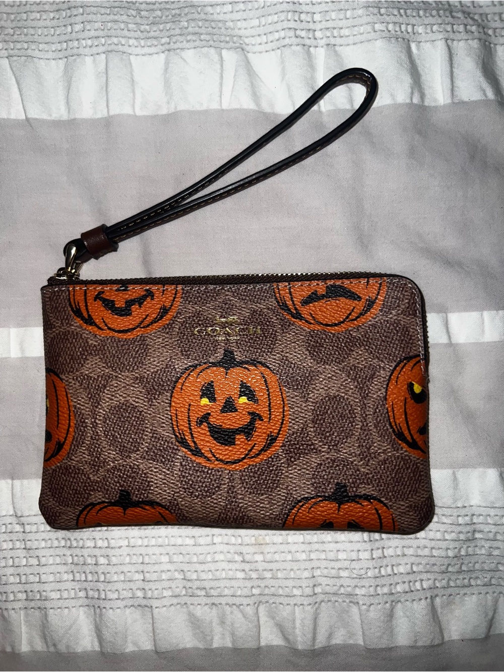 Coach pumpkin wristlet